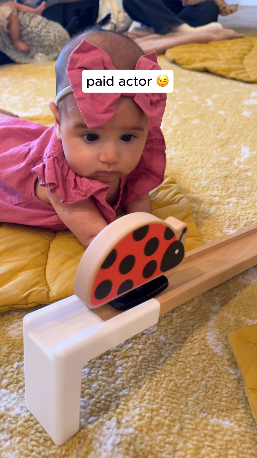 Paid actor 🤝 real baby, both fully committed — and the Look At Me Ladybug stealing the show 🐞
